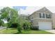 A charming two-story home with well-maintained landscaping and neutral-toned siding at 11445 Congaree Way, Indianapolis, IN 46235
