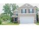 Charming two-story home with a two-car garage and well-maintained lawn at 11445 Congaree Way, Indianapolis, IN 46235