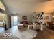 Inviting living room with ample seating and a decorative shelving unit at 11503 Winding Wood Dr, Indianapolis, IN 46235
