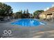 Relaxing community pool with plenty of lounge chairs for residents to enjoy at 11503 Winding Wood Dr, Indianapolis, IN 46235