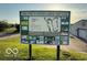 Sign for Winding Ridge Golf Club with course layout and sponsor logos at 11503 Winding Wood Dr, Indianapolis, IN 46235