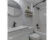 Bright bathroom with white vanity, oval mirror, and decorative shelving at 3270 Cherokee Cir, Bargersville, IN 46106