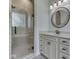 Elegant bathroom featuring a glass shower with tile surround and a vanity with granite countertops and modern fixtures at 3270 Cherokee Cir, Bargersville, IN 46106