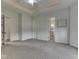 Spacious bedroom with a white ceiling and carpeted floor and a door leading to a bathroom at 3270 Cherokee Cir, Bargersville, IN 46106
