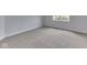 Bedroom featuring plush carpeting, base trim and a bright window illuminating the room at 3270 Cherokee Cir, Bargersville, IN 46106
