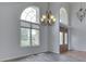 Bright foyer showcases large windows, hardwood floors, decorative chandelier, and stained glass double doors at 3270 Cherokee Cir, Bargersville, IN 46106