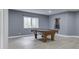 Basement game room featuring a pool table, wood-look floors and a window at 3270 Cherokee Cir, Bargersville, IN 46106
