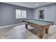 Basement game room featuring a pool table, wood-look floors and a window at 3270 Cherokee Cir, Bargersville, IN 46106