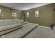 Home theater with stepped seating, comfortable couches, projector, and sconce lighting at 3270 Cherokee Cir, Bargersville, IN 46106