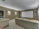 Inviting home theater with comfortable seating, a projector screen, and sconce lighting at 3270 Cherokee Cir, Bargersville, IN 46106