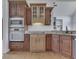 Kitchen features built-in microwave and oven, custom cabinets, and granite countertops at 3270 Cherokee Cir, Bargersville, IN 46106