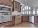 Modern kitchen with stainless steel appliances, granite countertops, and stylish cabinetry at 3270 Cherokee Cir, Bargersville, IN 46106