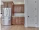 The kitchen features stainless steel refrigerator, custom cabinets and granite countertops at 3270 Cherokee Cir, Bargersville, IN 46106