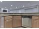 Basement kitchenette with light wood cabinets and stainless steel appliances at 3270 Cherokee Cir, Bargersville, IN 46106