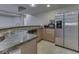 Basement kitchenette includes a sink, dishwasher, and stainless steel refrigerator at 3270 Cherokee Cir, Bargersville, IN 46106