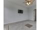 Simple room with tile floors and a blank TV on the wall at 3270 Cherokee Cir, Bargersville, IN 46106