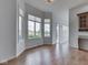 Bright living room featuring wood floors and large windows with outside views at 3270 Cherokee Cir, Bargersville, IN 46106
