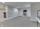 Basement living room with plush carpeting, a white shelf and a glass door on the side at 3270 Cherokee Cir, Bargersville, IN 46106