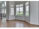 Bright living room offers three large windows with great natural light, hardwood floors, and neutral walls at 3270 Cherokee Cir, Bargersville, IN 46106