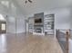 The great room features hardwood floors, an open floor plan, a fireplace, and custom shelving creating a cozy atmosphere at 3270 Cherokee Cir, Bargersville, IN 46106