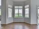 Bright living room with large windows overlooking a green backyard at 3270 Cherokee Cir, Bargersville, IN 46106