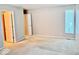 Spacious bedroom with ensuite bath, natural light, and neutral walls at 3400 W Riggin Rd, Muncie, IN 47304