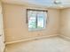 Carpeted bedroom with natural light, neutral paint and ceiling fan at 3400 W Riggin Rd, Muncie, IN 47304
