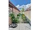 Exterior patio view showing a mulched garden with a variety of healthy green plants at 3400 W Riggin Rd, Muncie, IN 47304
