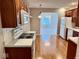 Kitchen includes modern appliances and laminate floor at 3400 W Riggin Rd, Muncie, IN 47304