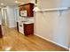 Bright kitchen with white appliances and laminate flooring at 3400 W Riggin Rd, Muncie, IN 47304