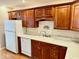 Kitchen features white appliances and wooden cabinetry at 3400 W Riggin Rd, Muncie, IN 47304