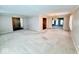 Large living room showcasing the open floor plan with views into the dining room at 3400 W Riggin Rd, Muncie, IN 47304