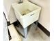 A practical utility sink provides a dedicated space for cleaning and household tasks at 3400 W Riggin Rd, Muncie, IN 47304