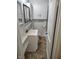 Cozy bathroom featuring a vanity with open shelves and a mirrored medicine cabinet at 5332 Fletcher Ave, Indianapolis, IN 46219