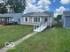 Charming single-story home with a well-maintained lawn, convenient access ramp, and inviting curb appeal at 5332 Fletcher Ave, Indianapolis, IN 46219