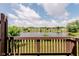 Scenic backyard view overlooking a lake and neighboring townhomes from the deck at 5370 Bay Harbor Dr, Indianapolis, IN 46254