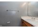 Powder room featuring a single sink vanity with wood cabinets and gray paint at 5370 Bay Harbor Dr, Indianapolis, IN 46254