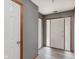 Entryway showcasing modern gray walls, sleek laminate floors, and bright white doors at 5370 Bay Harbor Dr, Indianapolis, IN 46254