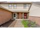 A townhome duplex with brick and beige siding offers a charming front entrance at 5370 Bay Harbor Dr, Indianapolis, IN 46254