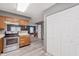 Open kitchen with wood cabinets, stainless steel appliances, and eat-in breakfast nook at 5370 Bay Harbor Dr, Indianapolis, IN 46254