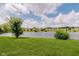 A lush lawn and serene pond offer relaxing views from this townhome community at 5370 Bay Harbor Dr, Indianapolis, IN 46254
