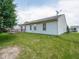 A well-maintained backyard featuring a deck, lawn, and the home's exterior at 5548 Glen Canyon Dr, Indianapolis, IN 46237