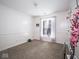 Bright bedroom with neutral carpet, large window, and charming decor at 5548 Glen Canyon Dr, Indianapolis, IN 46237