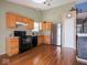 Bright kitchen with wooden cabinets and modern lighting fixtures at 5548 Glen Canyon Dr, Indianapolis, IN 46237