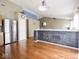 Open-concept living space with hardwood floors and stainless steel refrigerator at 5548 Glen Canyon Dr, Indianapolis, IN 46237