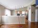 Living area with hardwood floors, and a view of the kitchen at 5548 Glen Canyon Dr, Indianapolis, IN 46237
