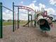 Community playground with slides and climbing structures providing a safe and engaging play area for children at 6253 Wasco Dr, Whitestown, IN 46075