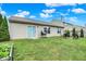 Spacious backyard features lush lawn, patio seating, grill, and well-maintained landscaping at 6383 Enclave Blvd, Greenwood, IN 46143