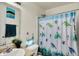 Bathroom featuring a mirror, shower curtain with sea turtle design, and toilet at 6383 Enclave Blvd, Greenwood, IN 46143