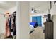 View of the large closet and bedroom with ceiling fan and neutral carpet at 6383 Enclave Blvd, Greenwood, IN 46143